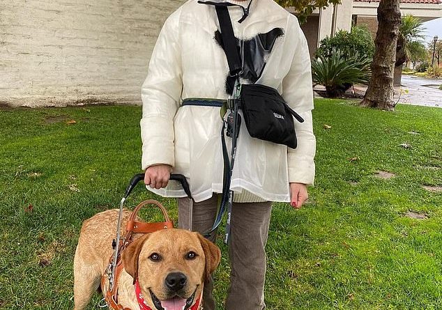 Working as a team: Selma Blair posted a photo standing next to her dog Scout after the two graduated from training after about 18 months